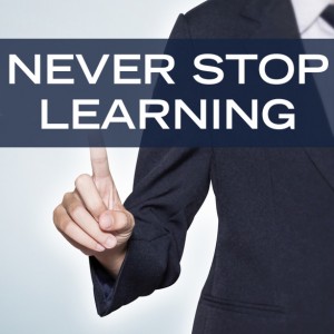 Man pointing to words ‘never stop learning’